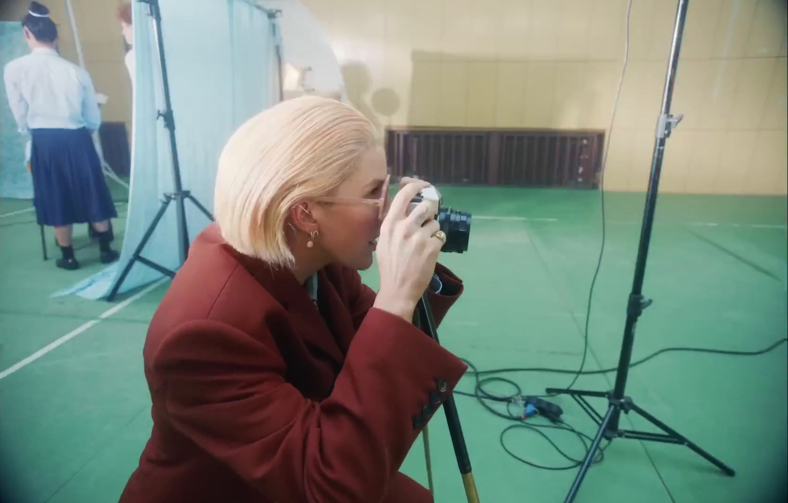 a woman taking a picture of a photographer