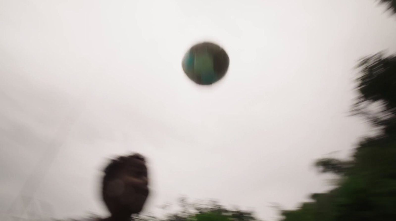 a blurry photo of a person throwing a frisbee