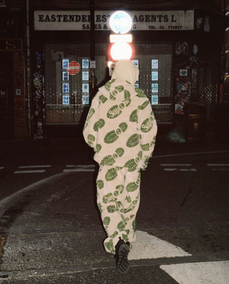 a person walking down a street at night