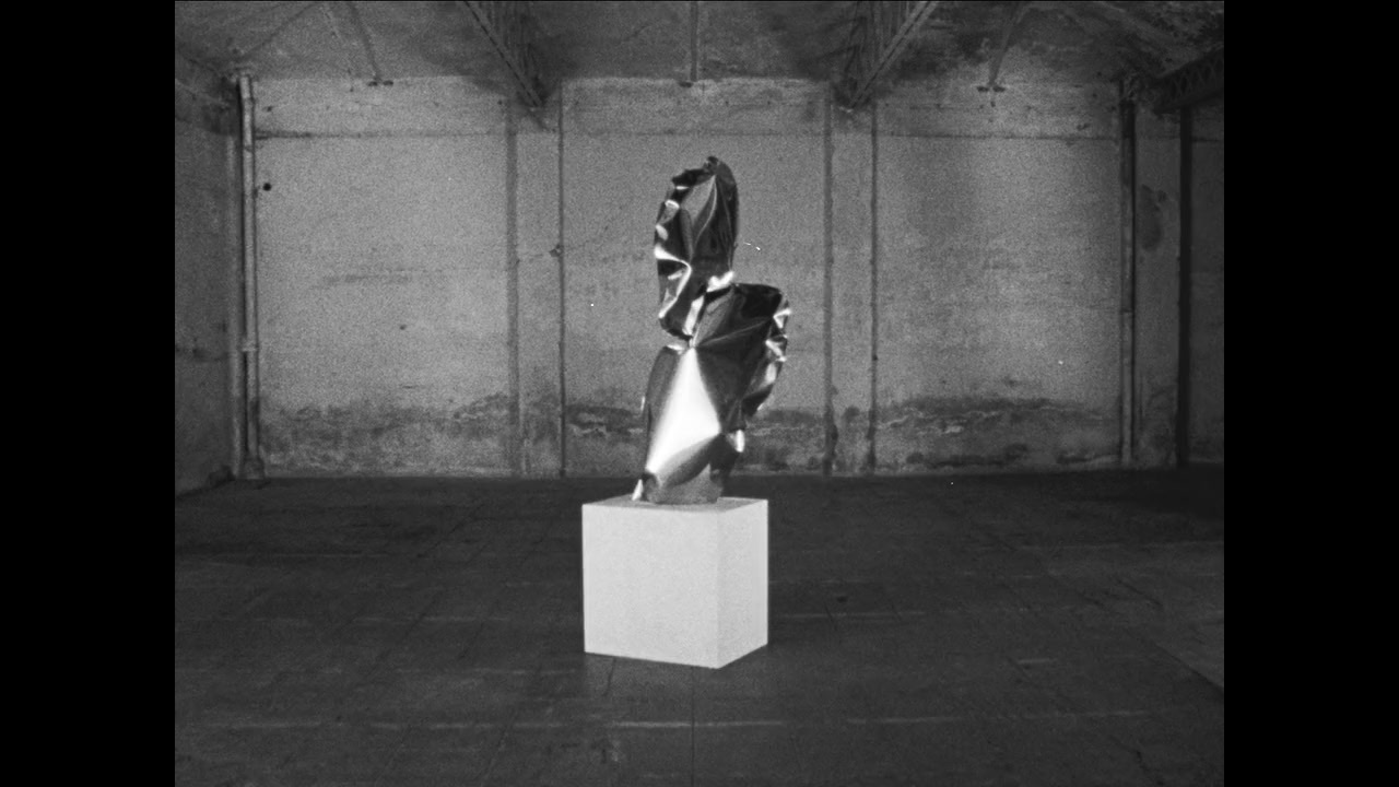 a black and white photo of a sculpture