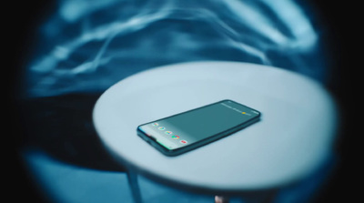 a cell phone sitting on top of a white table