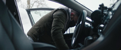 a man in the back seat of a car