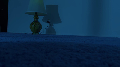 a lamp and a lamp shade on a blue carpet