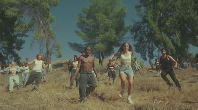 a group of people running through a field