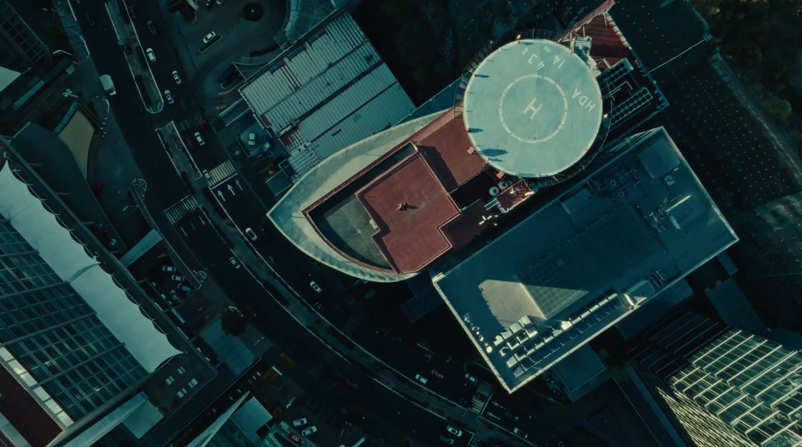 an aerial view of a basketball court in a city