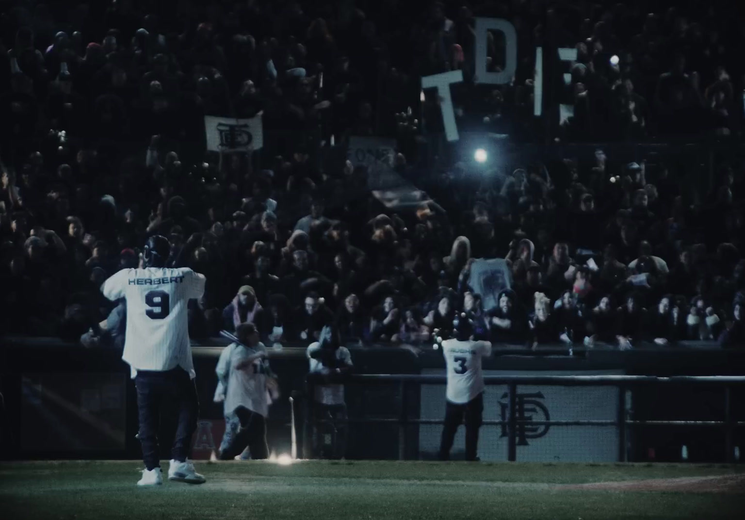 a baseball player standing on top of a field