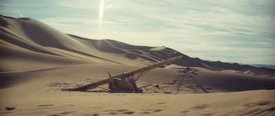 a cross in the middle of a desert