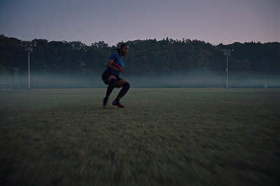 a man in a field with a soccer ball