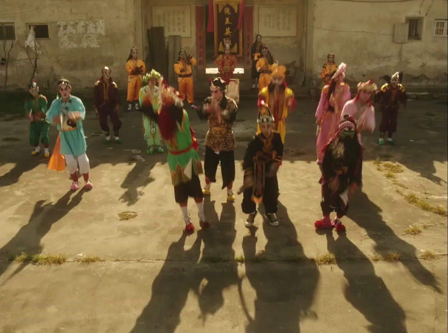 a group of people standing on top of a cement ground