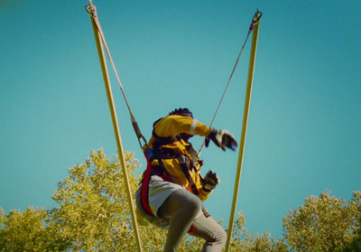 a person on a rope course in the air