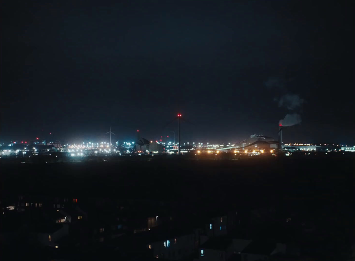 a view of a city at night from a distance