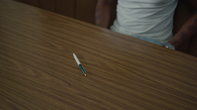 a pen sitting on top of a wooden table