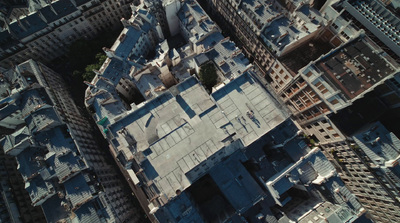 an aerial view of a city with tall buildings