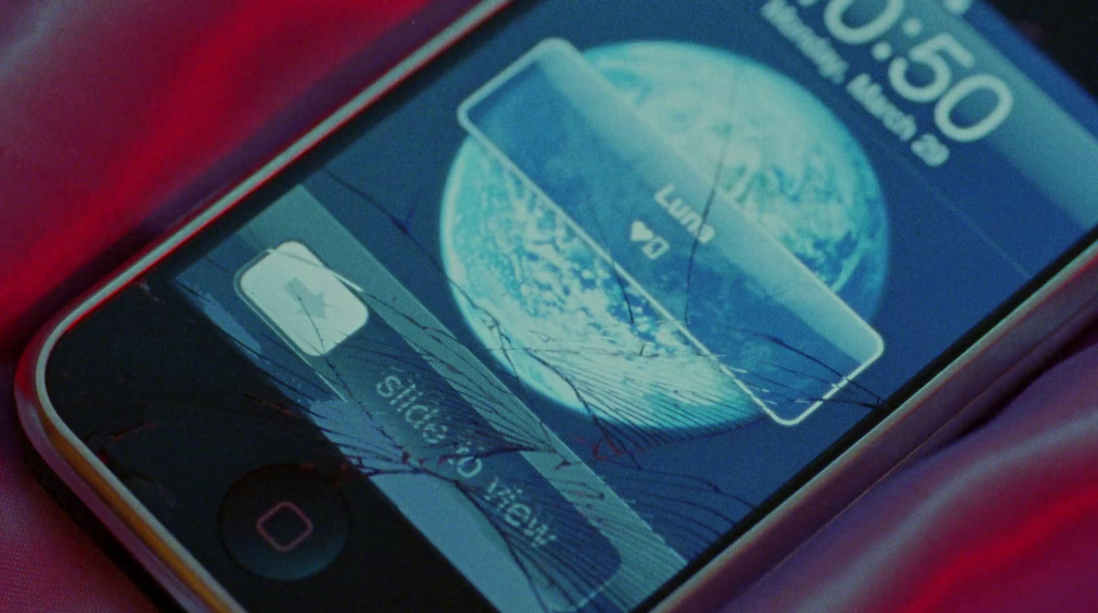 a close up of a cell phone with a credit card on it