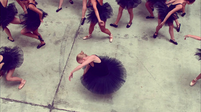 a group of dancers in black tutu skirts