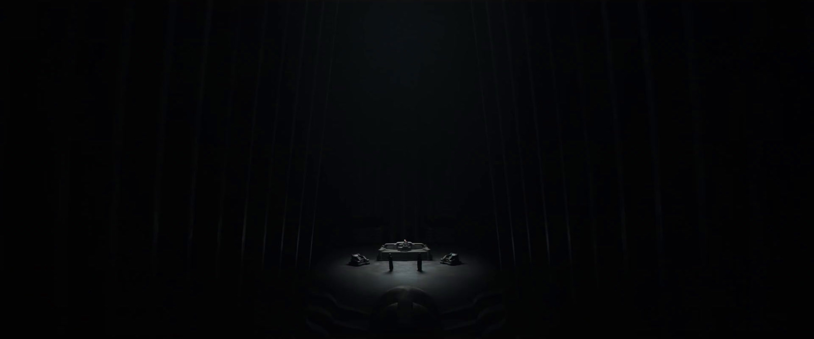 a piano sitting in the middle of a dark room