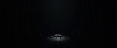 a piano sitting in the middle of a dark room