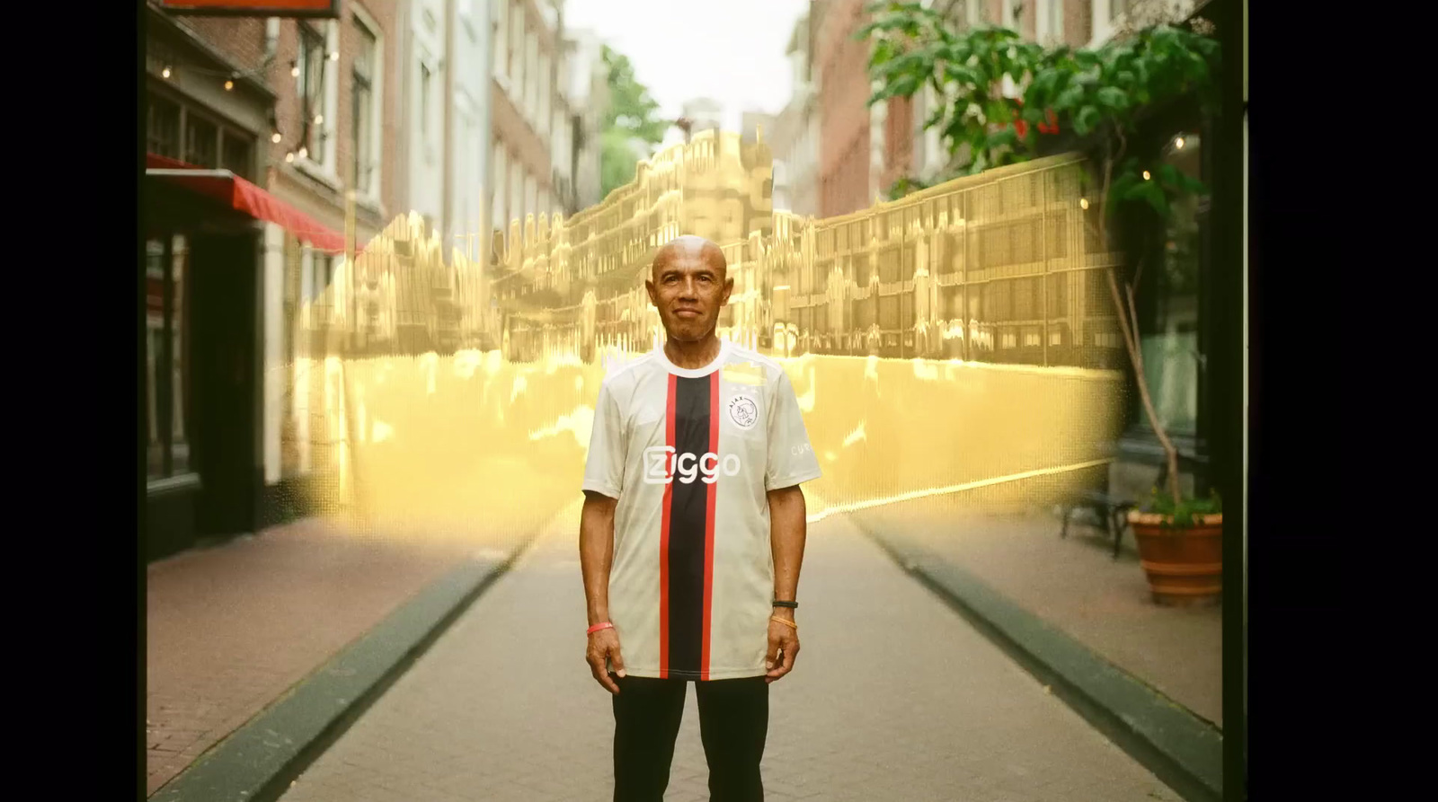 a man standing in the middle of a city street