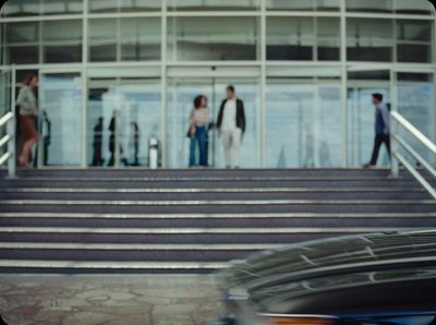 a group of people walking up a flight of stairs