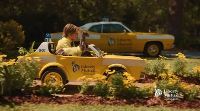 a young boy riding in a toy truck