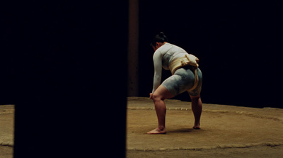 a woman standing on one leg in the middle of a circle