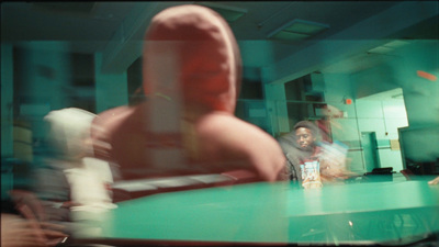 a blurry photo of a person sitting at a table