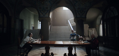 a group of people sitting around a wooden table