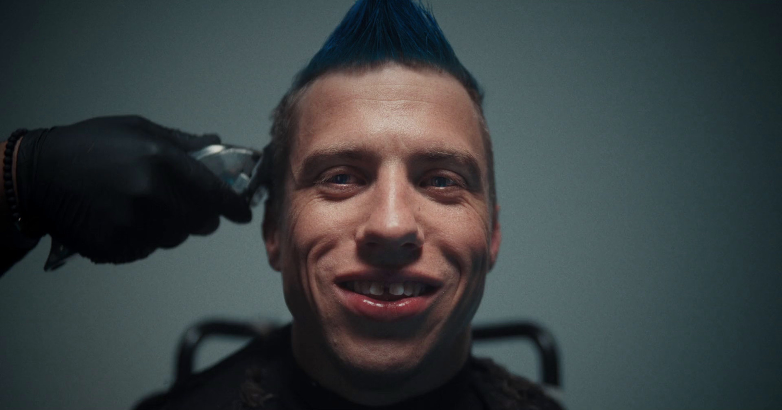 a close up of a person with blue hair