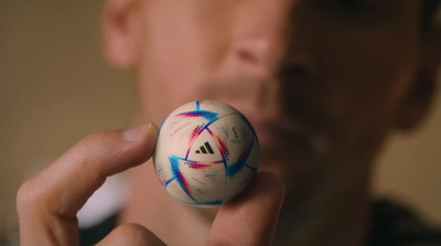 a close up of a person holding a ball