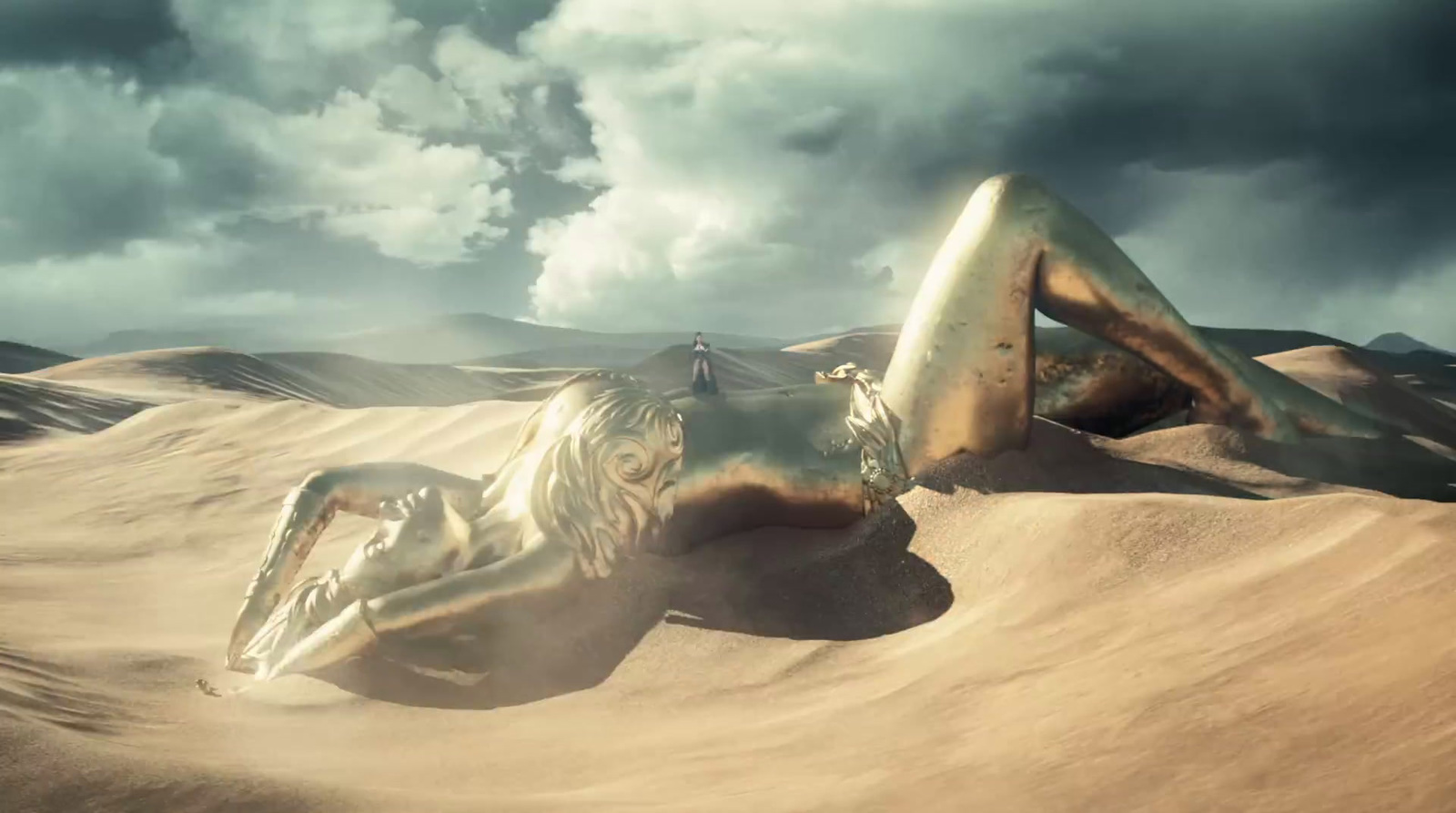 a woman laying on top of a desert covered in sand