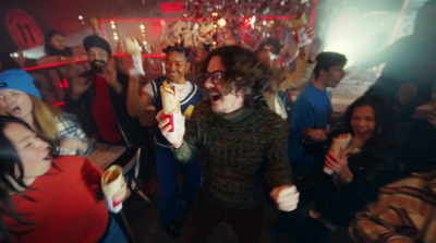 a group of people standing around a bar