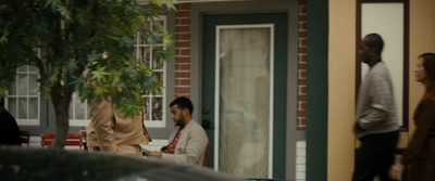 a group of people standing outside of a building