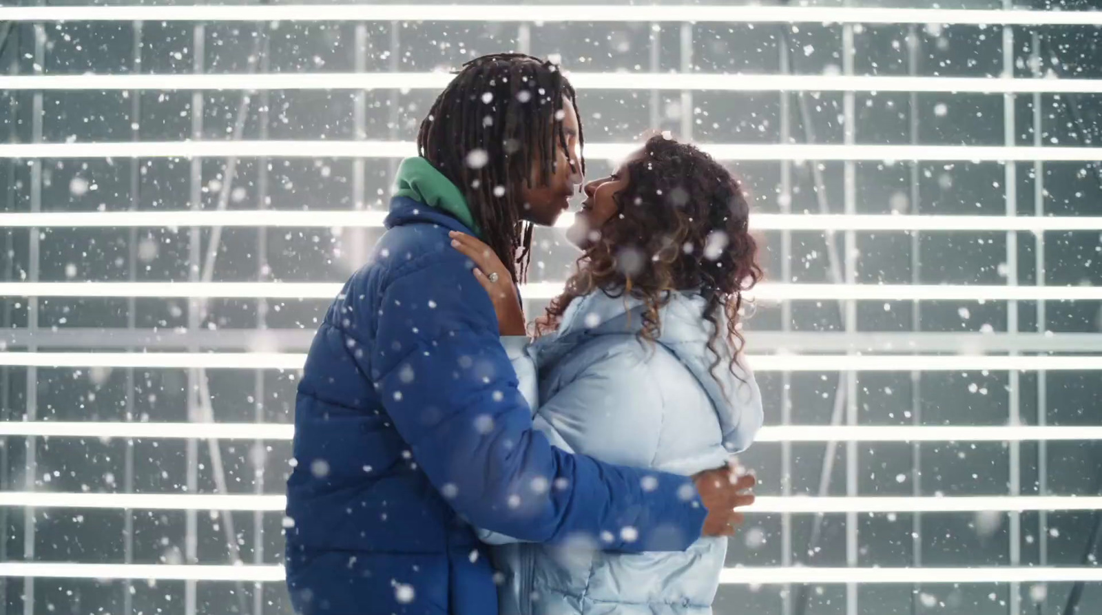 a couple of people that are standing in the snow