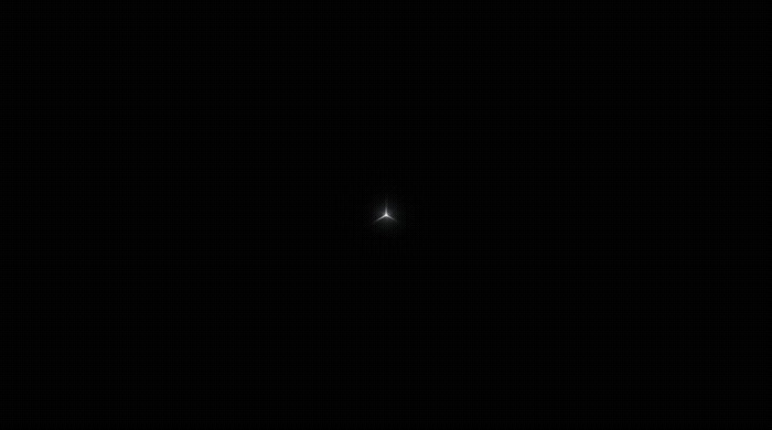 a black background with a small white object in the middle of it