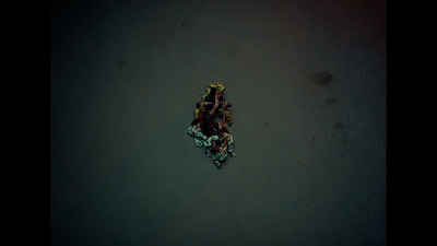 a group of people laying on top of a sandy beach