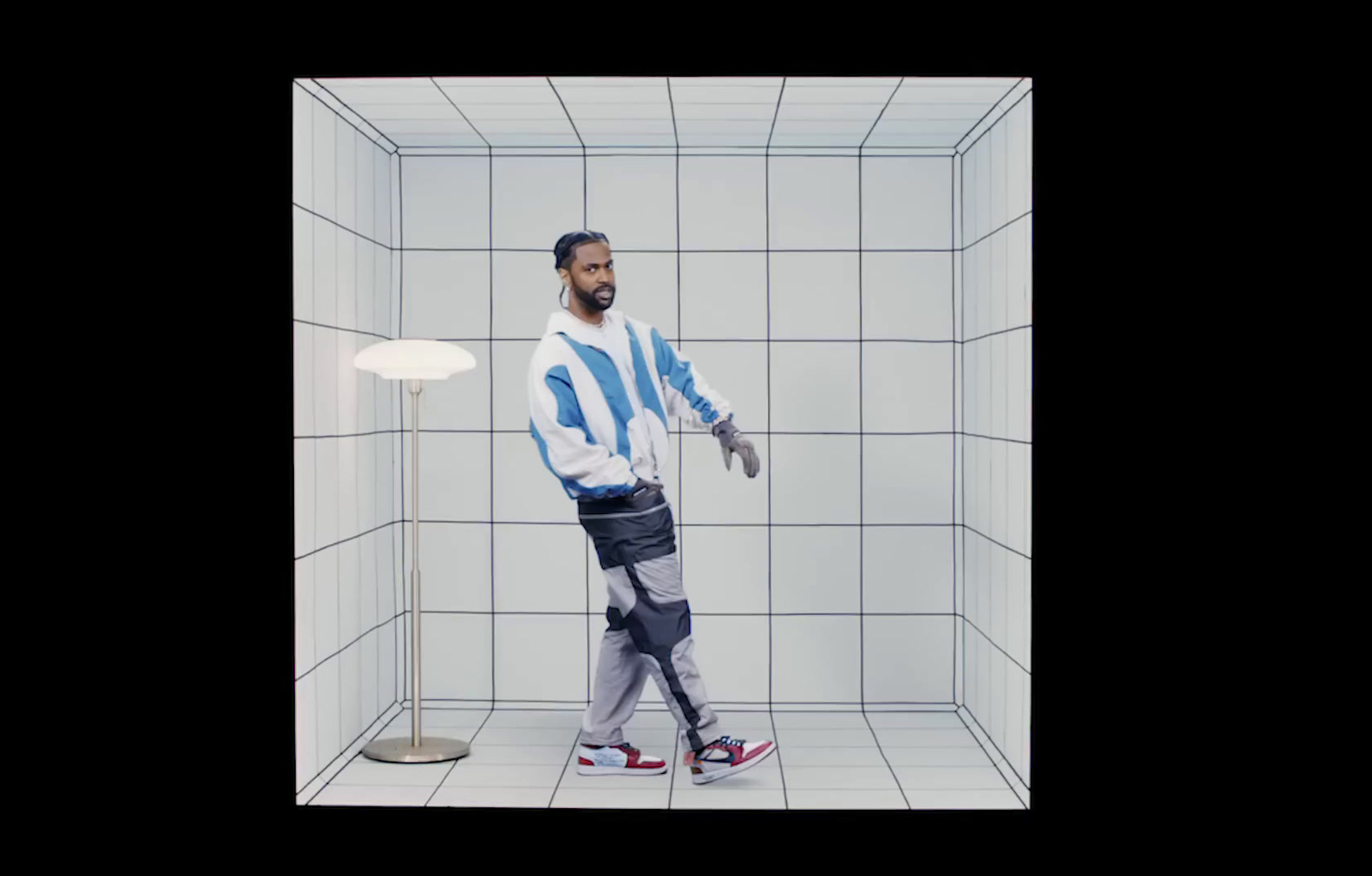 a man standing in a white tiled room