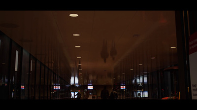 a long hallway with a lot of lights on the ceiling