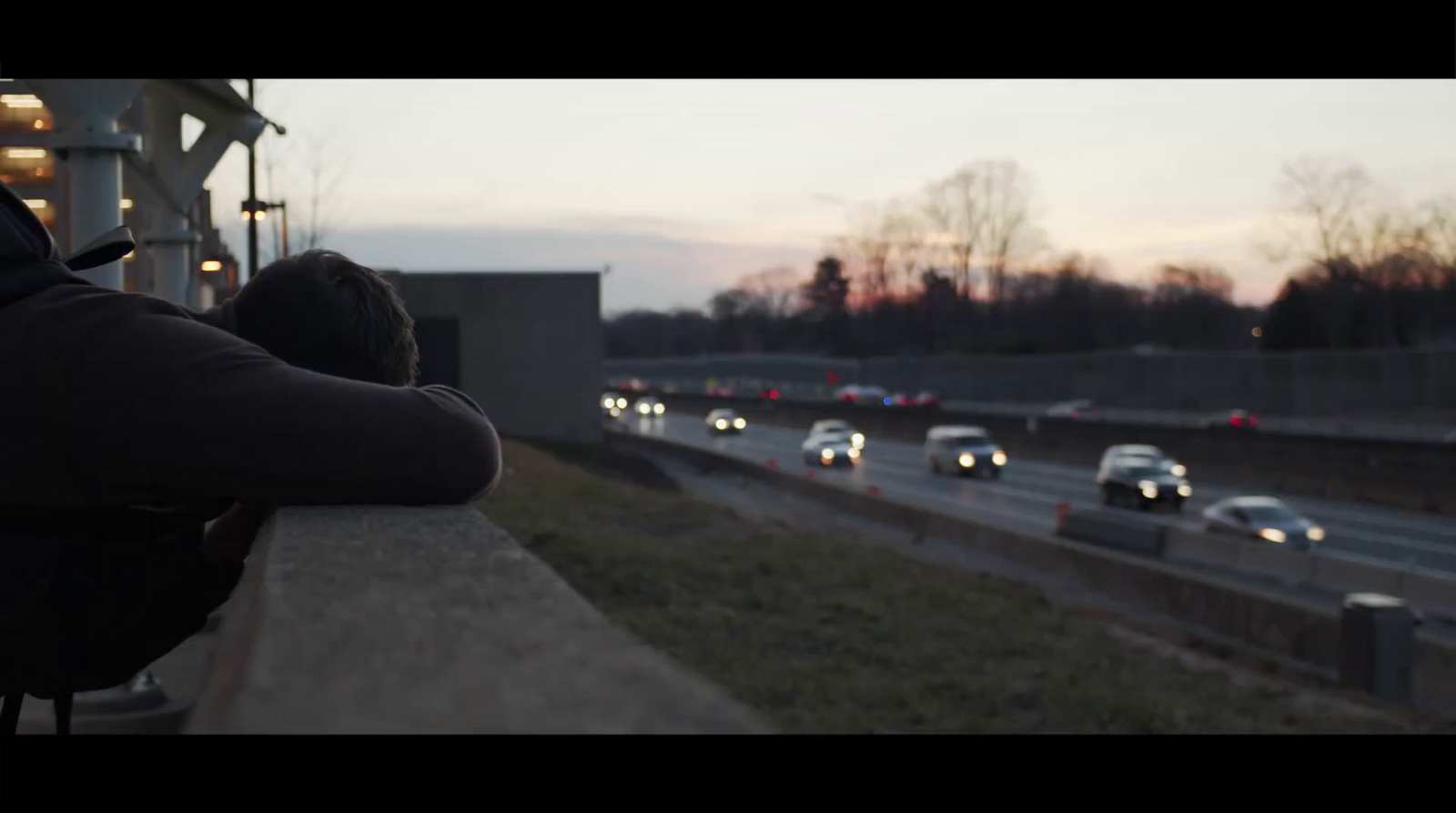 a couple of people that are sitting on a ledge