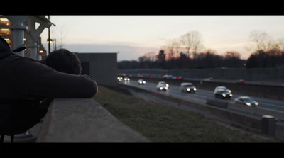 a couple of people that are sitting on a ledge