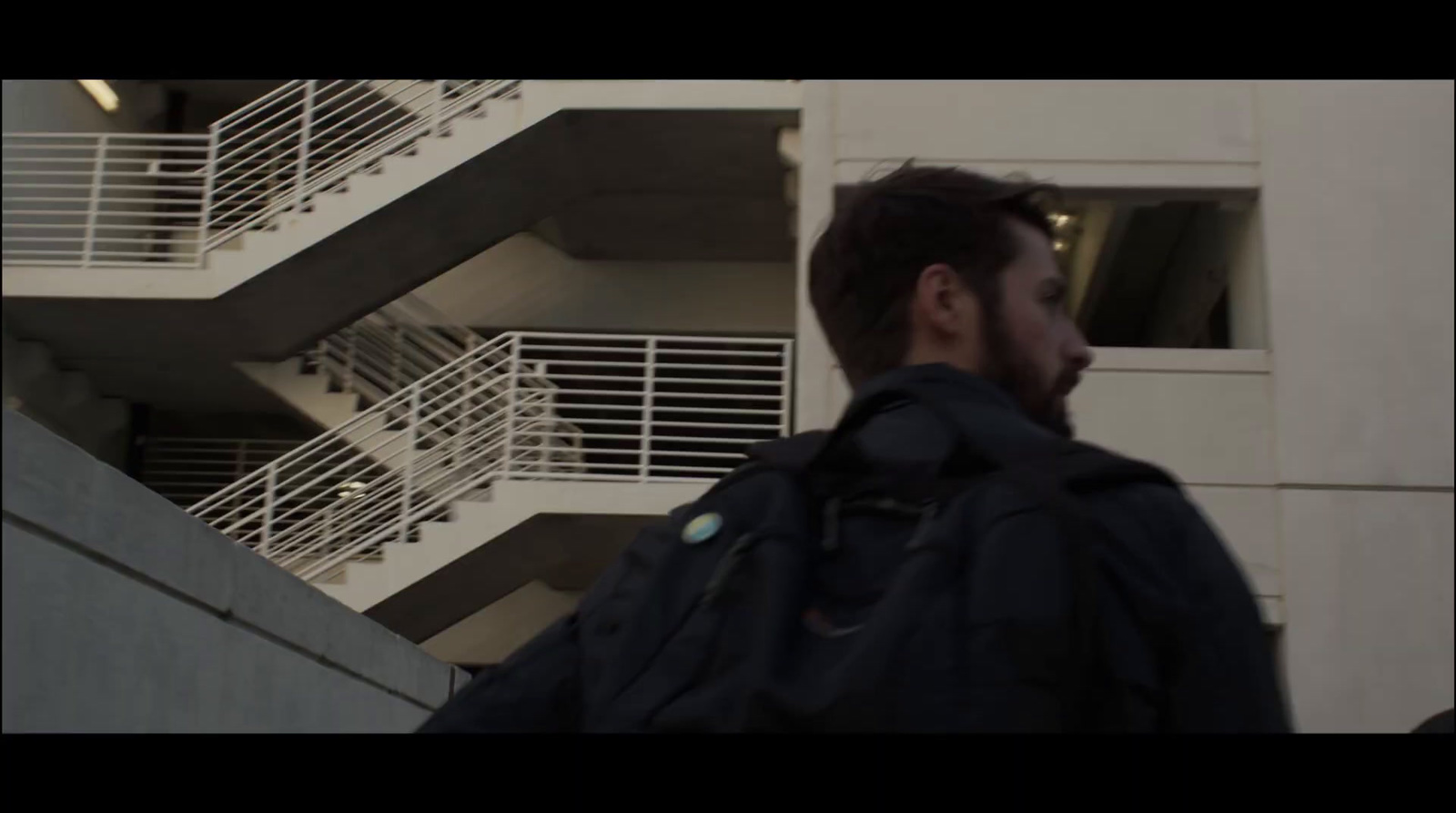 a man standing in front of a building