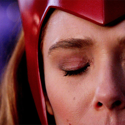 a close up of a woman with her eyes closed