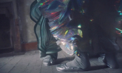 a person standing on a tiled floor in front of a fire place