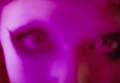 a blurry image of a man's face and eyes