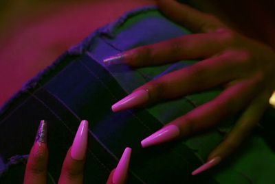 a woman's hands with pink and purple nails