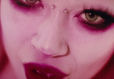 a close up of a woman's face with makeup