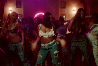 a group of young women dancing in a club