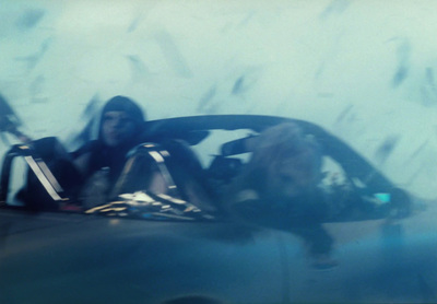 a woman sitting in the passenger seat of a car