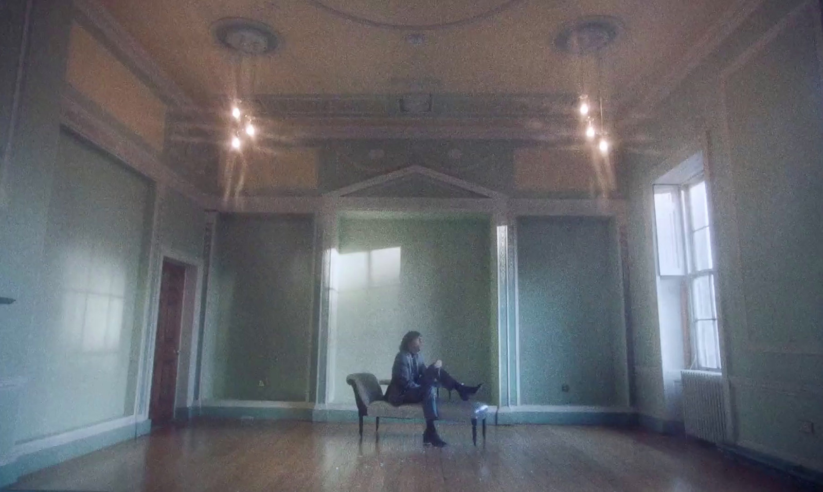 a person sitting on a chair in a room