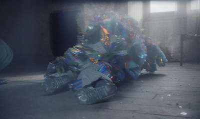 a pile of shoes sitting on top of a floor