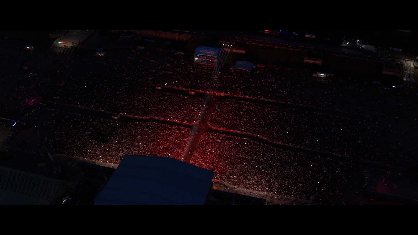 an aerial view of a parking lot at night